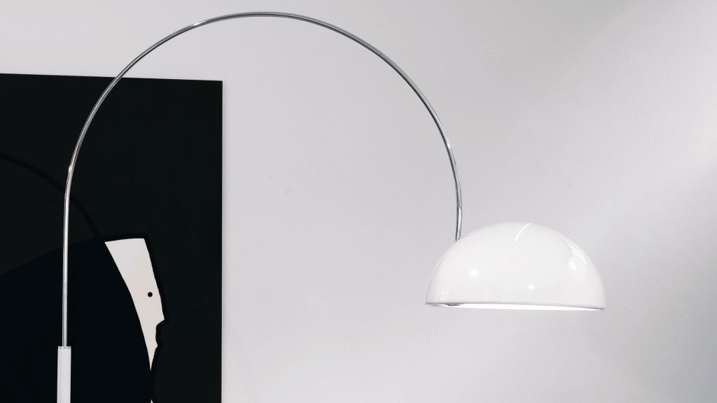 Dome-shaped floor lamp made of aluminum and metal in white tone on a white background.
