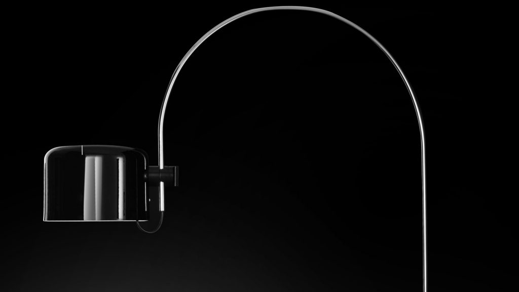 floor lamp made with a curved shape with a square head made of aluminum and metal in a black tone on a black background
