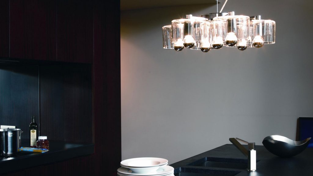 lamp made of black metal base and transparent fused glass structure designed in the shape of a flower