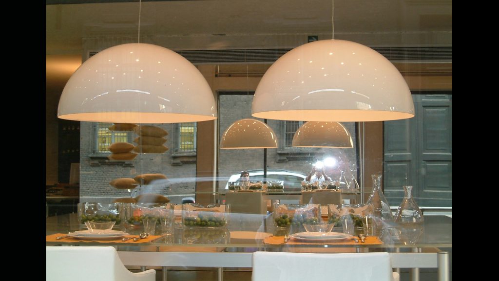 duo of white glass lamps made in the shape of a sphere with a beige tone background