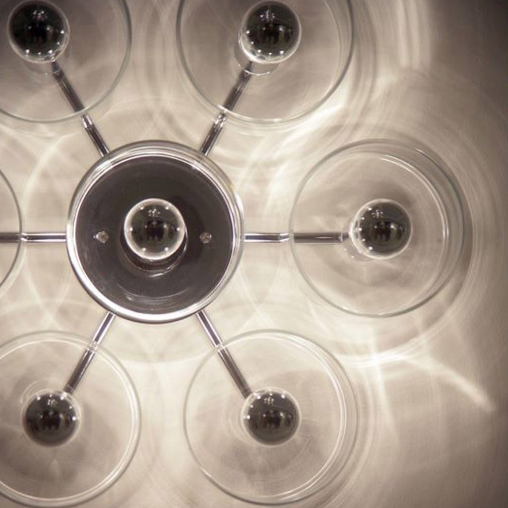 flower-shaped lamp made of metal base and transparent glass cylinders