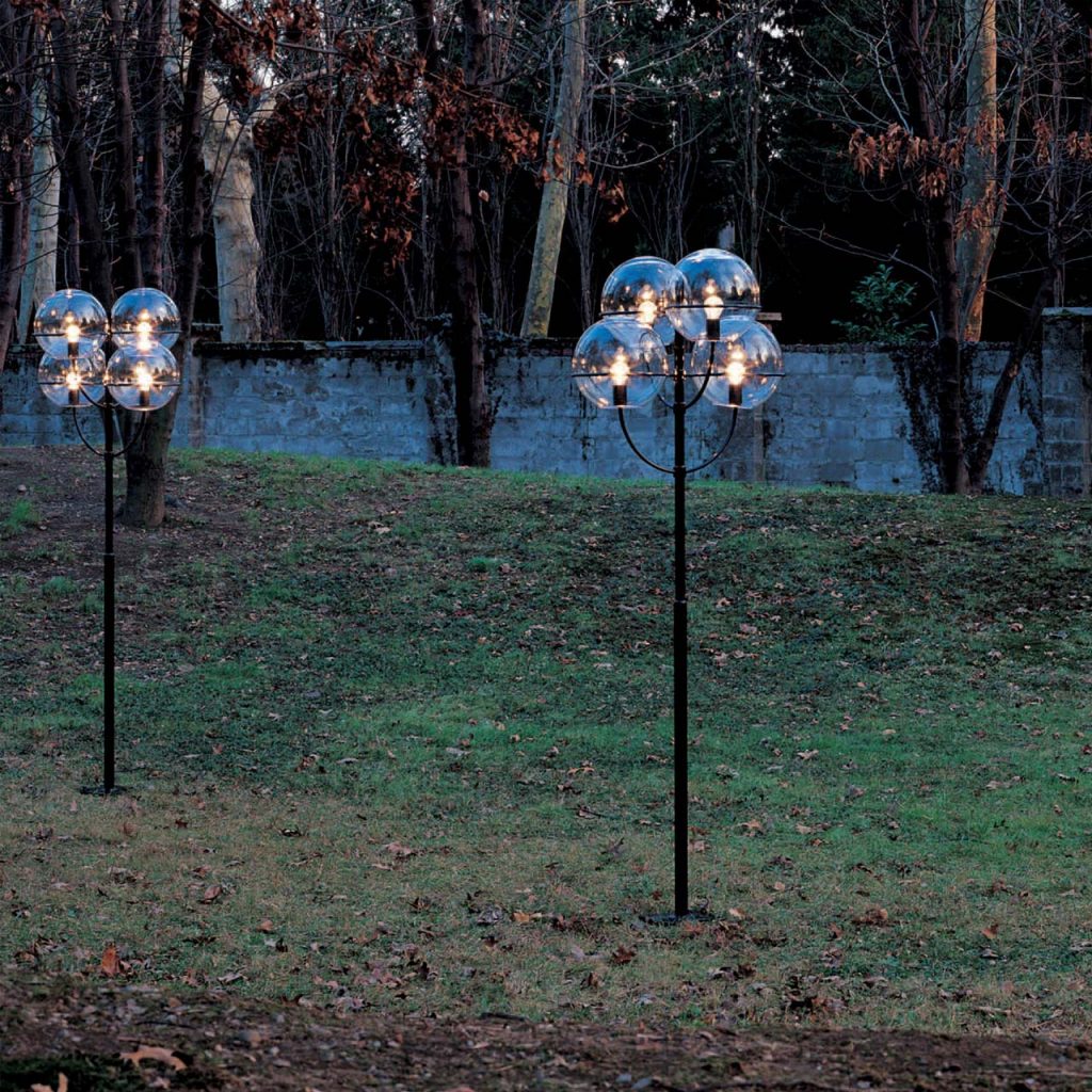 floor lamp made of black metal base with four glass spheres as the top