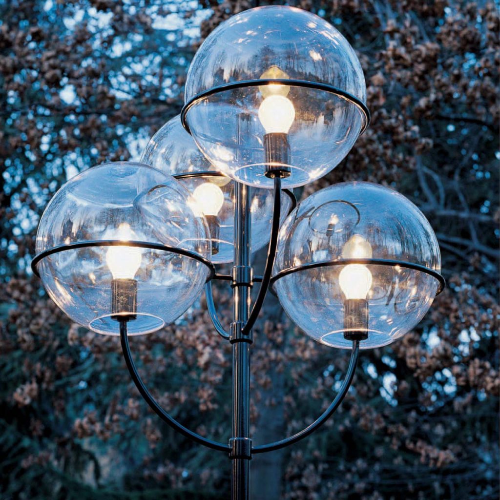 lamp with four transparent glass spheres and black metal base