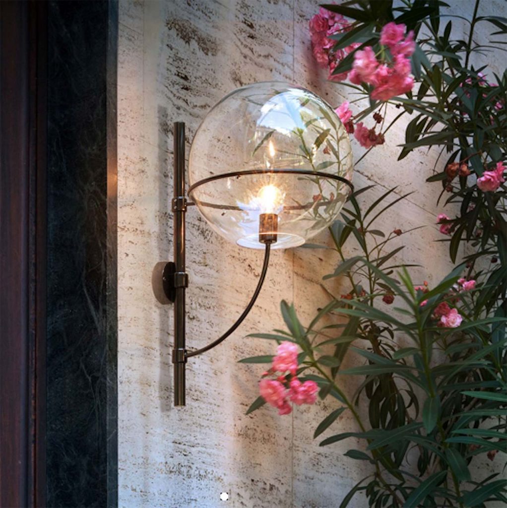 lamp made with transparent glass sphere and black metal base
