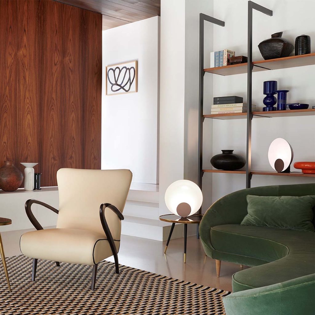 table lamps made of metal with front discs in shades of gold and coffee in an living room