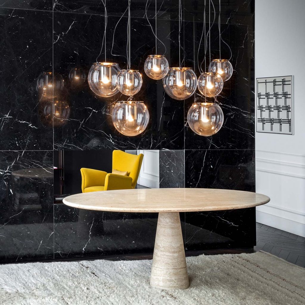 line of hanging lamps made of glass and black metal spheres