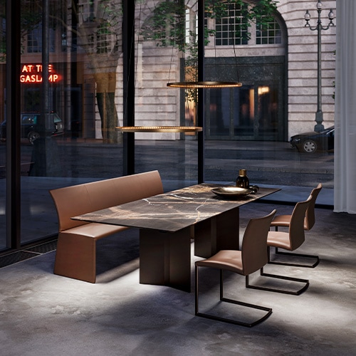 table made of black marble top in the shape of a rectangle and brown wooden legs