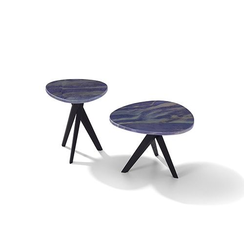 two stools made of wood and dark blue lacquered wood tops, tripod-shaped base on a white background