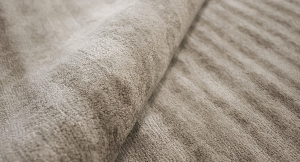 brown carpet with gray finishes in the shape of squares