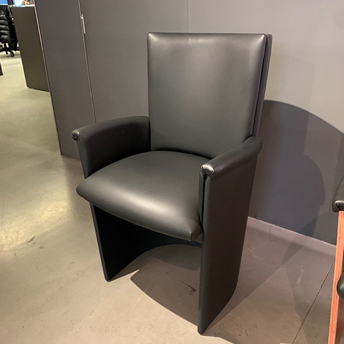 armchair made of leather in a black tone base made of wood