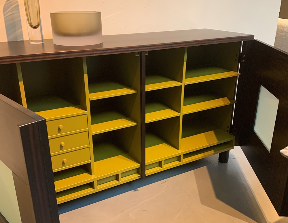 Interior features compartments for trays and shelving.