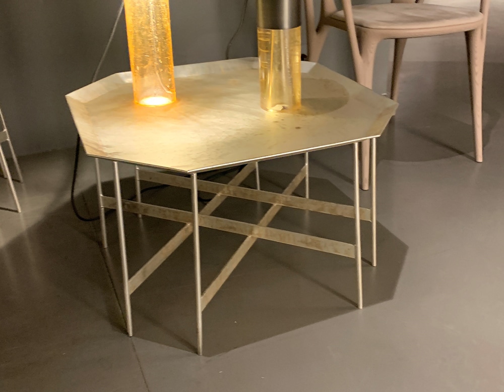 coffee table with octagon design made of meta base and silver finishes in a golden tone