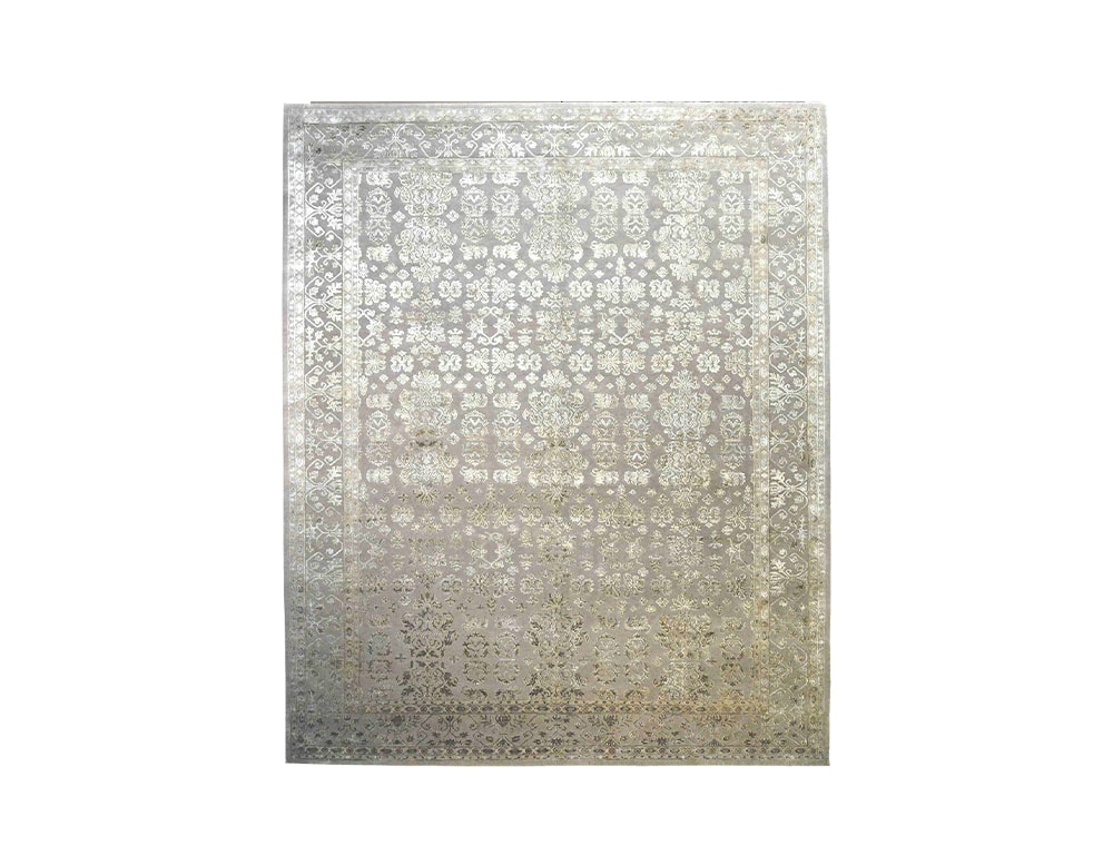 silk and fabric rug in a gray tone with a design in the shape of classic figures on a white background