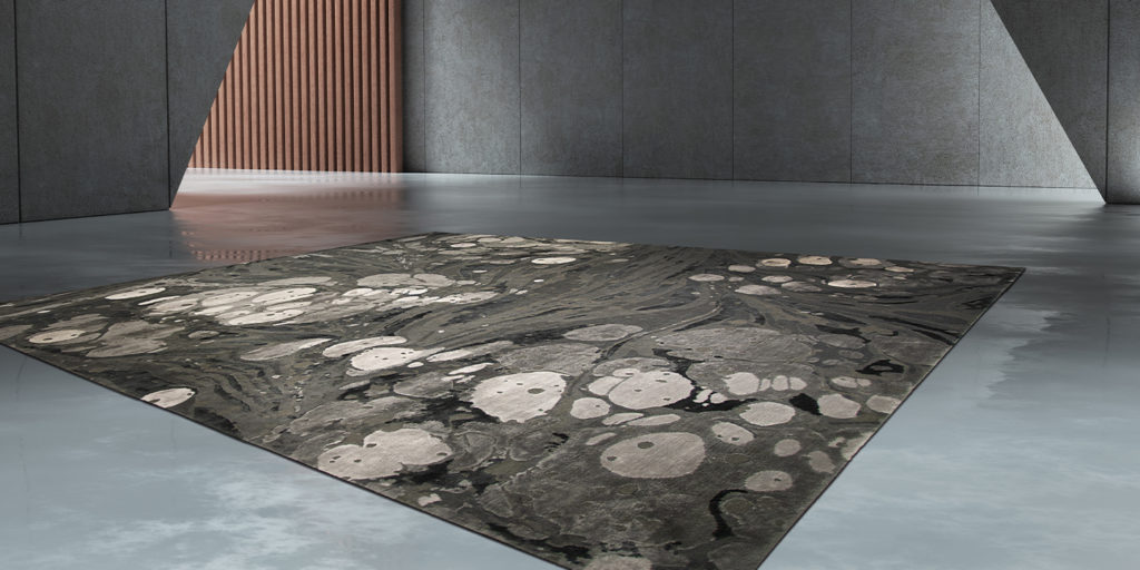 rug with shades of gray and white made with New Zealand Wool and natural silk relief in a room