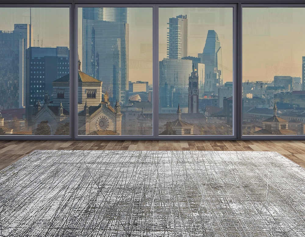 abstract rug made of wool and fabric base in a gray and white color tone with an imperfect linear design in a living room