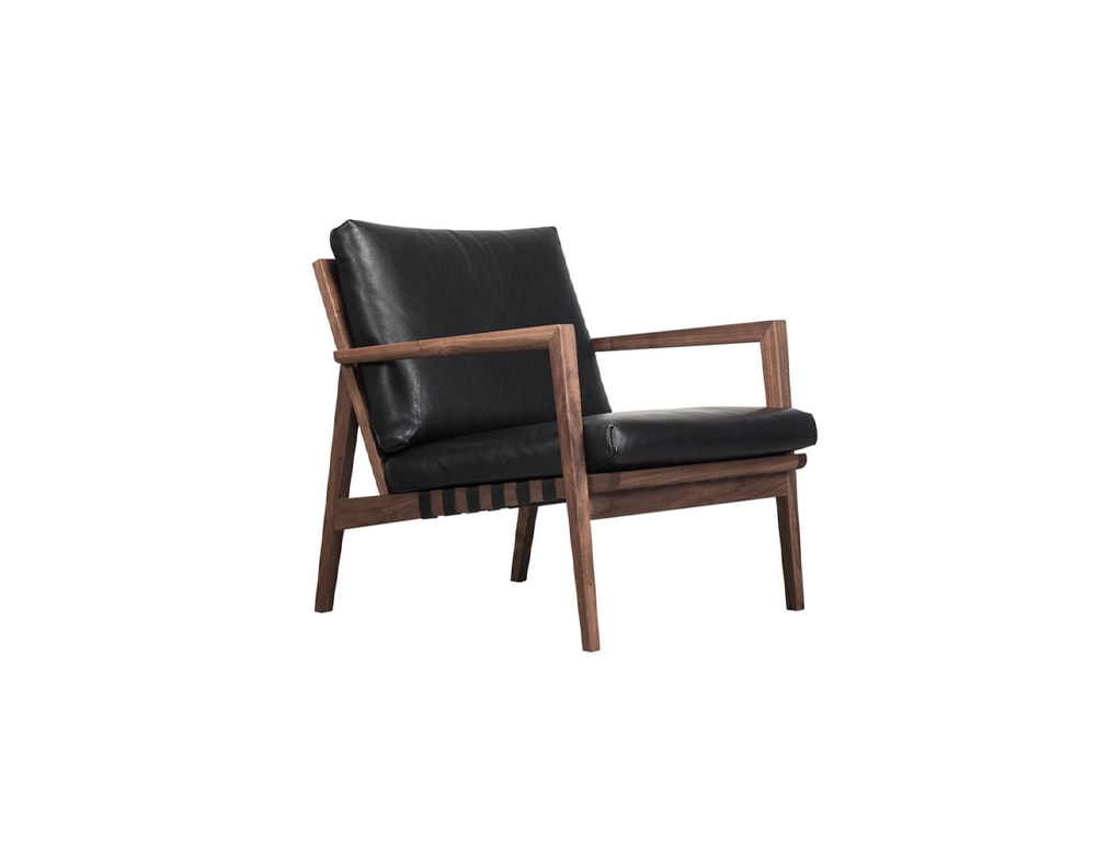 Armchair made of black fabric or leather with base made of brown oak or ash wood in an white background