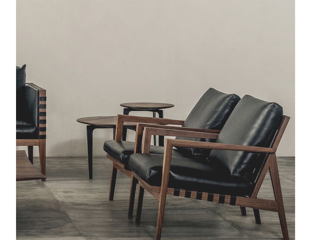 sofas made of brown wood and black leather