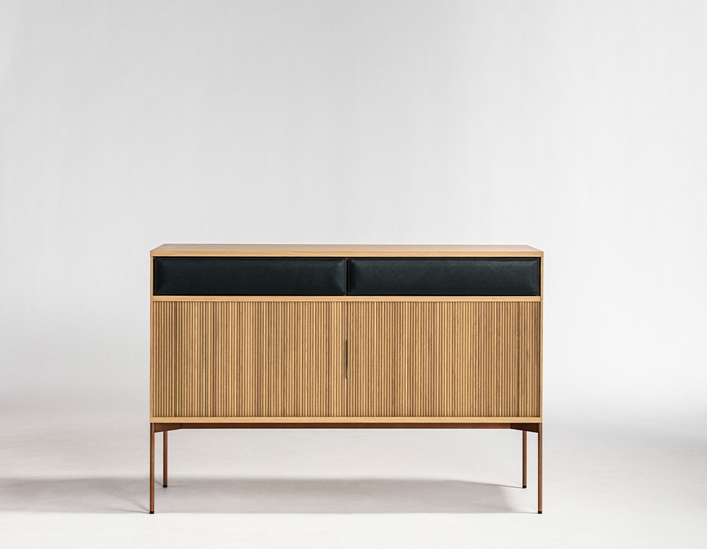 handmade sideboard made of brown cane and brown ash wood on a white background