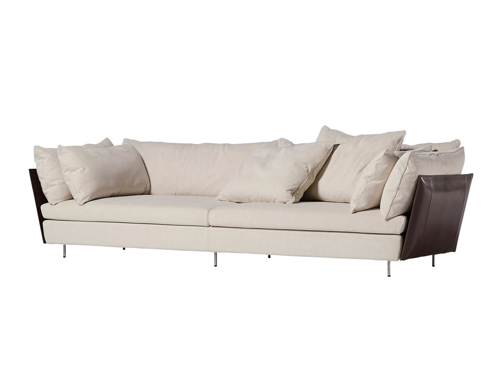 sofa made of steel base and upholstered in thick beige leather with brown finishes in a white background