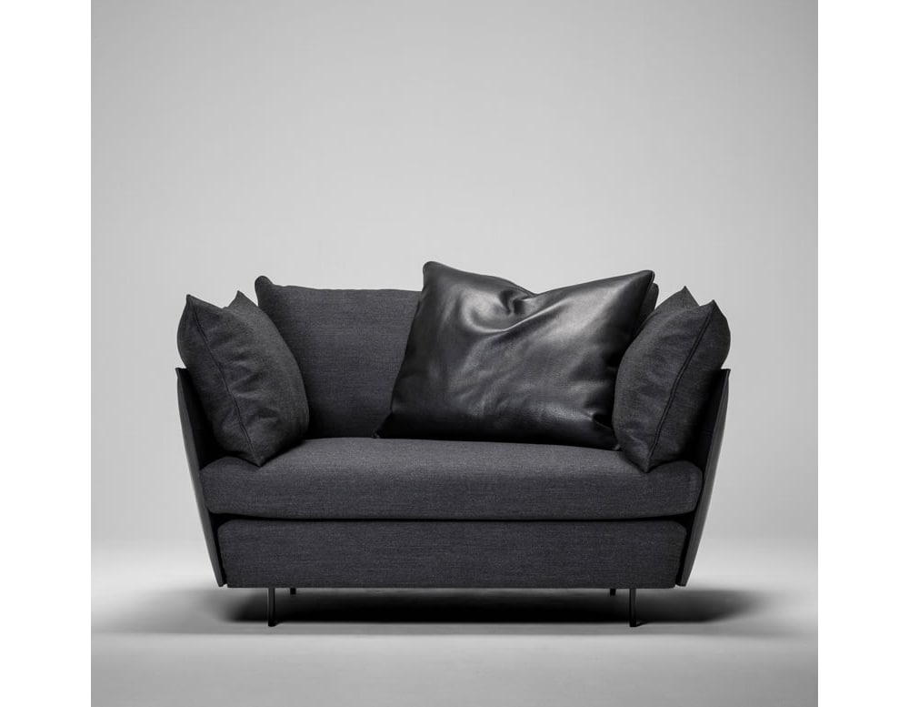 armchair made of steel and black leather base in a gray background