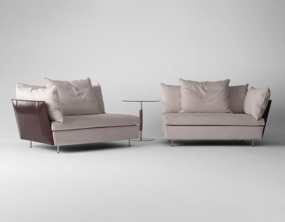 twin armchairs made of steel base and upholstered in beige fabric