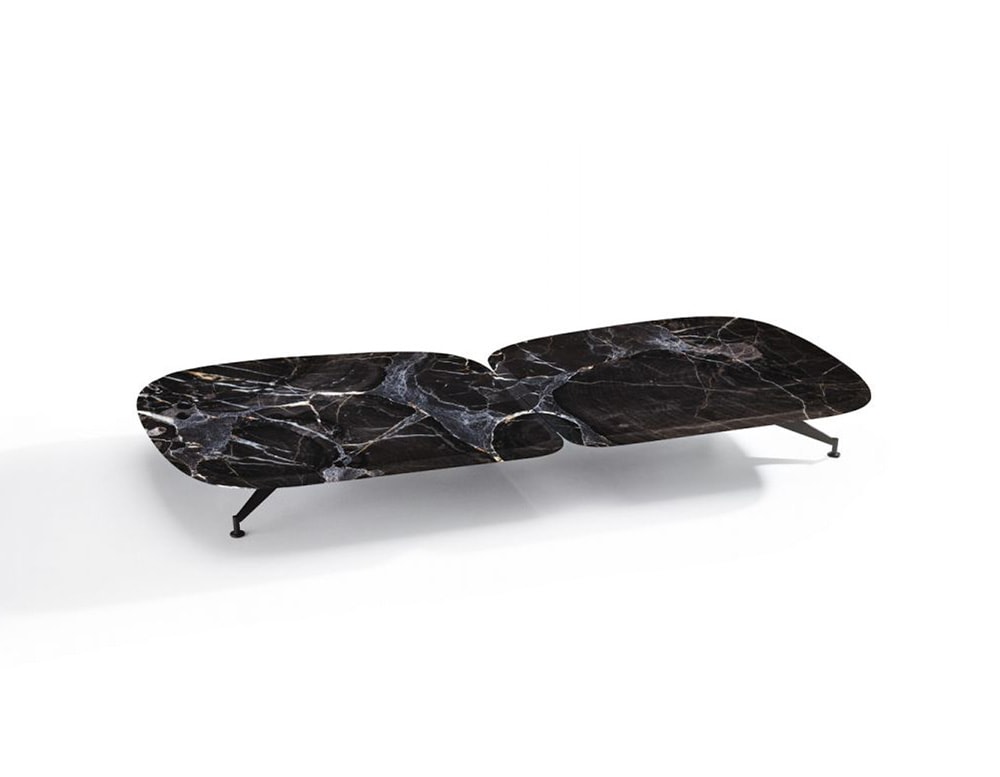 small table made of black marble base with matte lacquer finishes on a white background