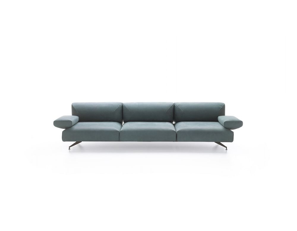 sofa made of fabric and aluminum on its retro legs in a blue tone on a white background