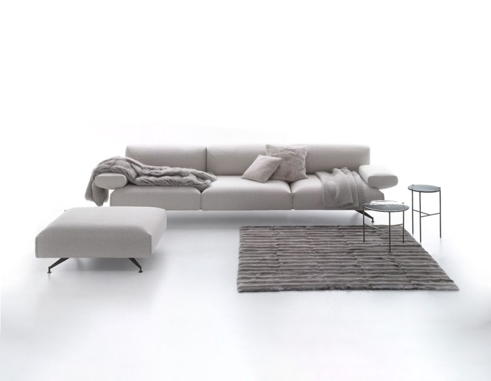 sofa made of fabric and polyretan foam in a light beige color on a white background