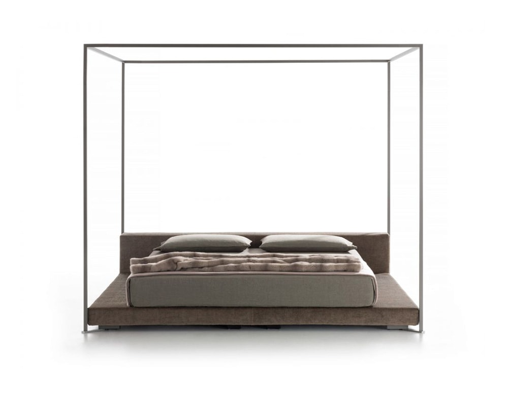 bed made with a metal structure surrounding it, wood and fabric in its structure in different shades of brown on a white background