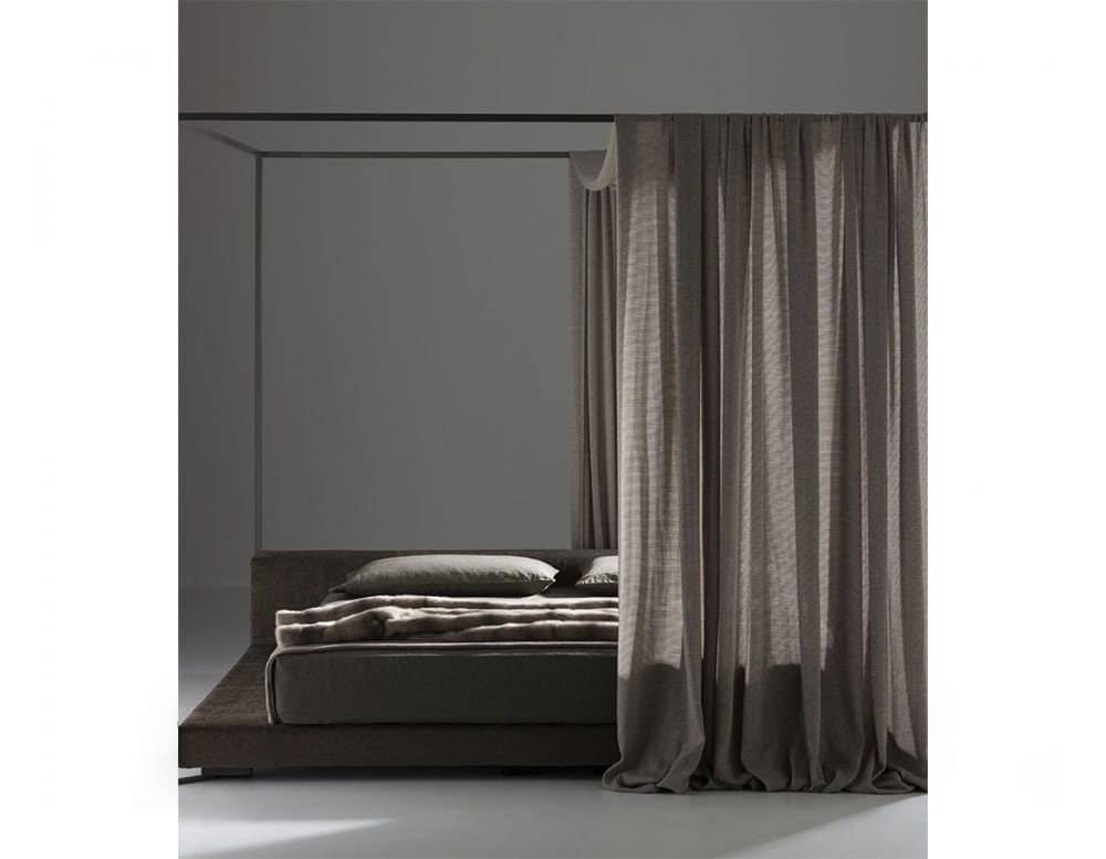 bed made with a metal structure surrounding it, wood and fabric in its structure in different shades of brown on a gray background