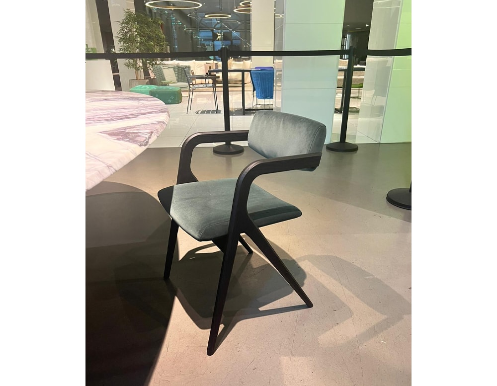 dining chair made of textile and velvet wood base in a blue tone in a living room