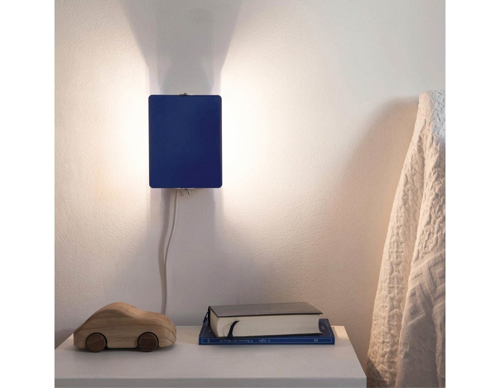 blue diffuser lamp made of aluminum in a room