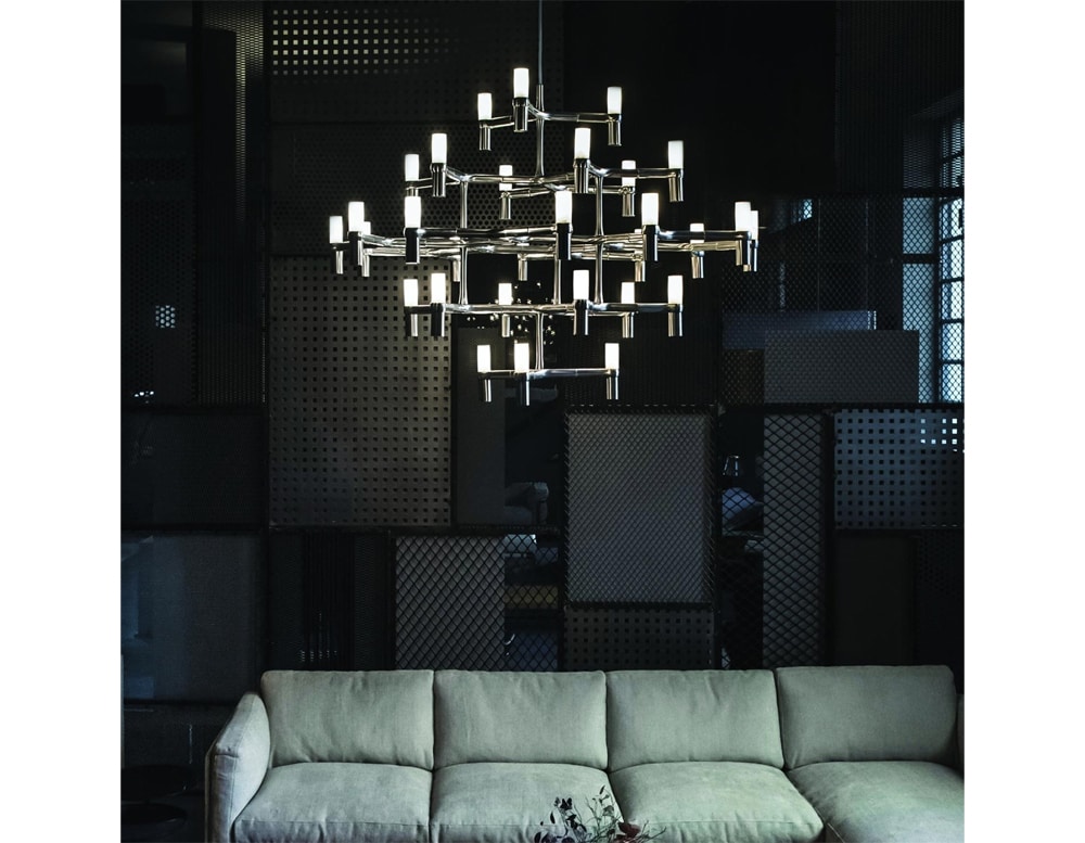 lamp made of black metal in the shape of a spider with white finishes