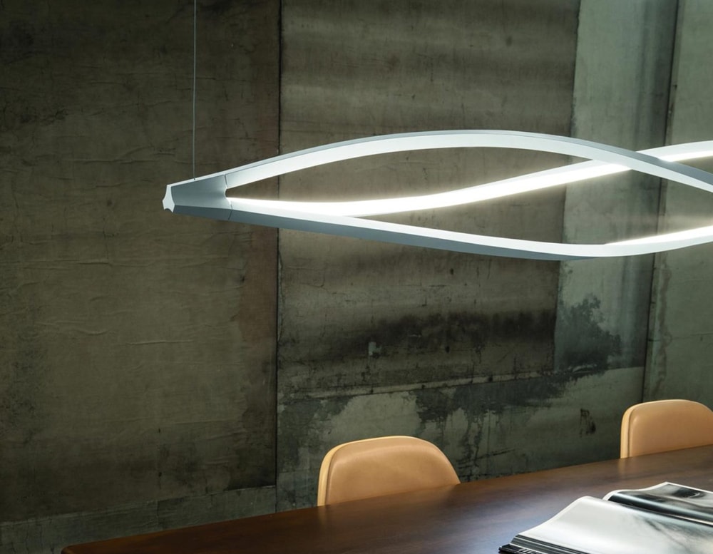 hanging lamp made of white-dyed metal in a living room