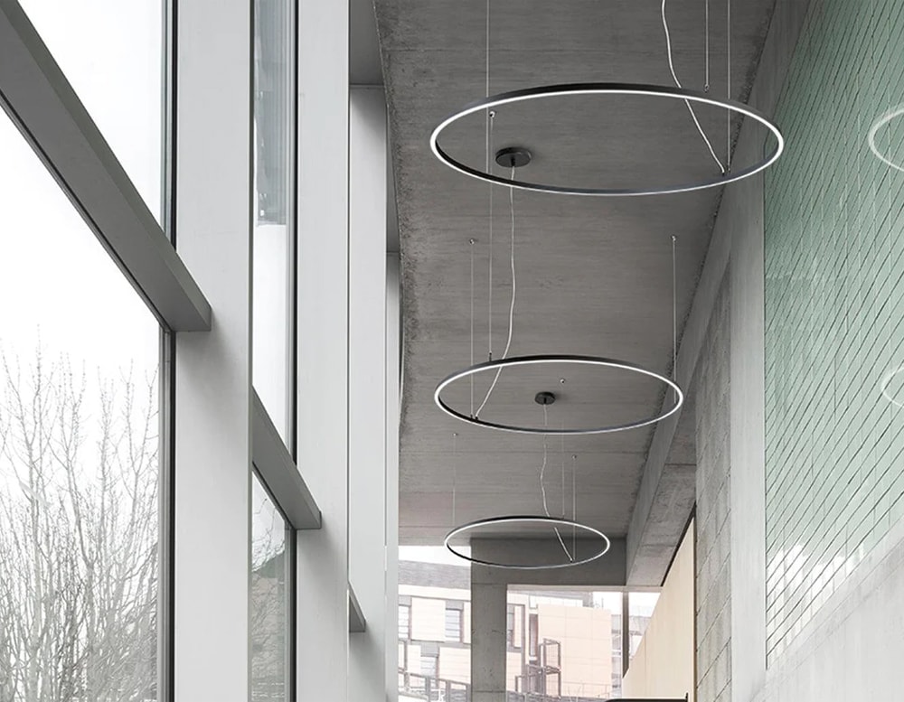 line of ceiling lamps in the shape of a circle made of metal