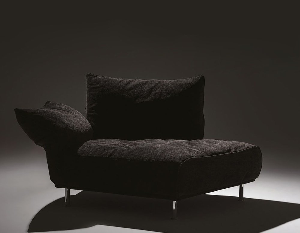 small sofa made of soft black fabric on a gray background