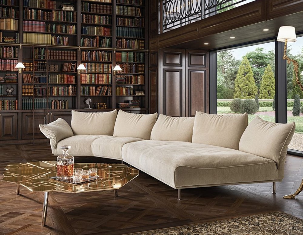 large sofa made of a metal base and upholstered in a soft fabric in a light beige tone