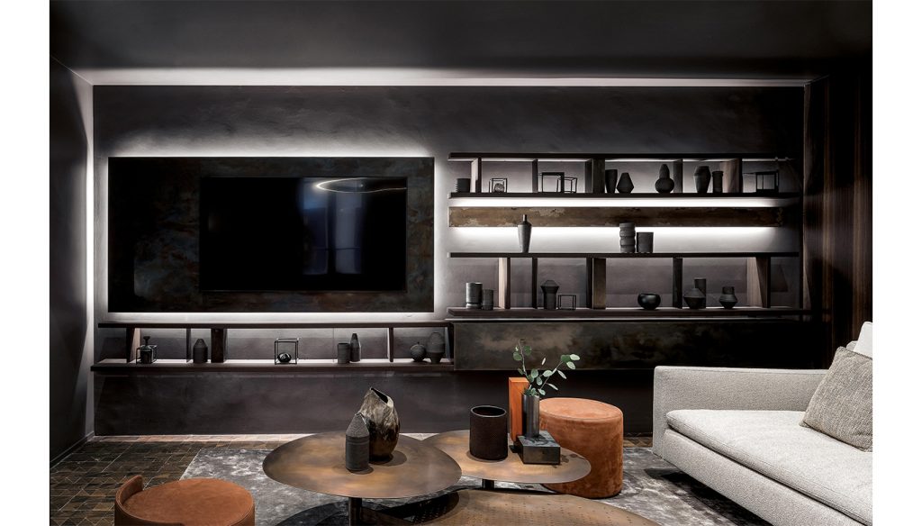 Hen Stile Set, a luxurious and modern living space featuring a sleek entertainment center, illuminated shelving, and elegant furniture in a sophisticated ambiance