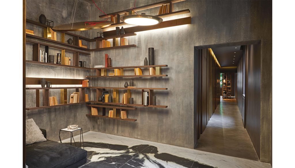 Hen Stile Set, a contemporary shelving system with integrated lighting, showcasing a stylish arrangement of books and decorative elements in a modern interior