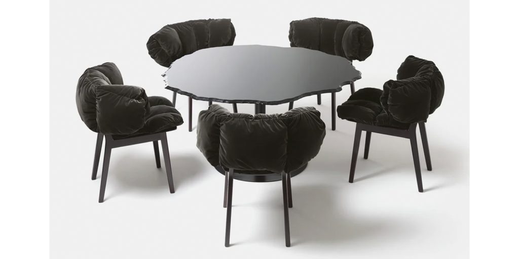 set of chairs made of wood base and soft black velvet plush on a white background