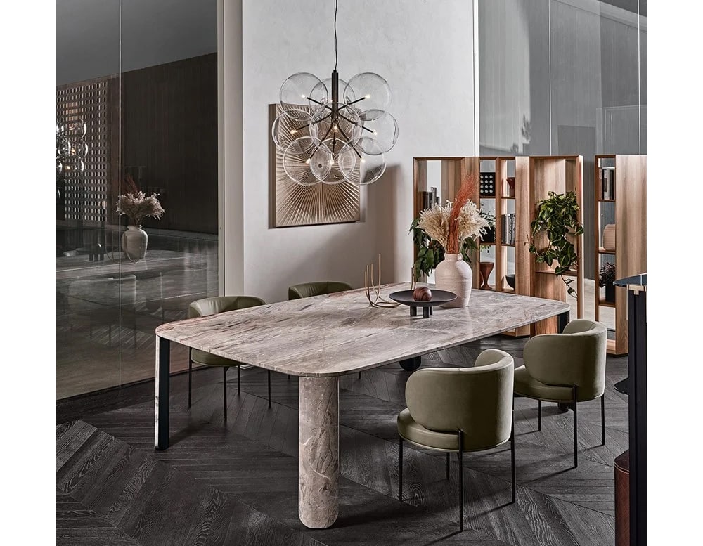 dining table made of white marble and metal base with satin finishes in a living room