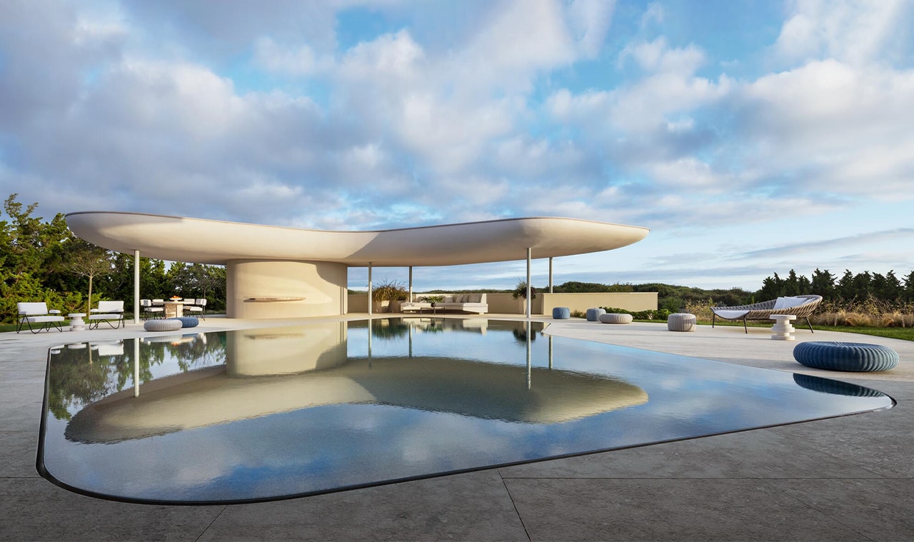 A modern architectural structure with a floating roof design, reflecting over a serene water body under a partly cloudy sky