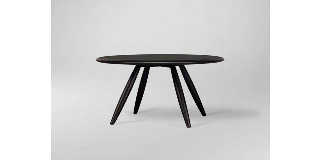 round coffee table made of solid wood base in a black tone on a white background