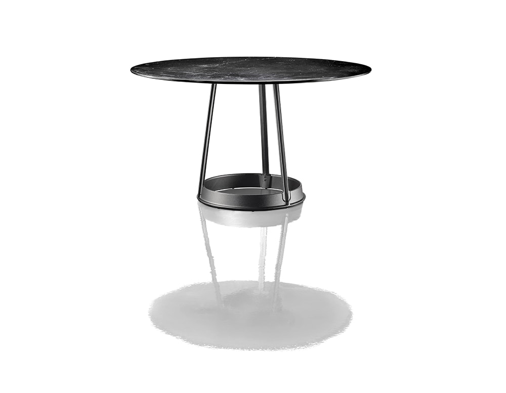 circle-shaped side table made of metal and black marble top on a white background