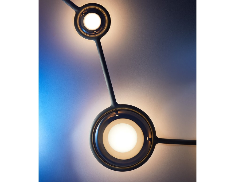 ceiling slats made of metal or glass in the shape of spheres connected by the same metal base