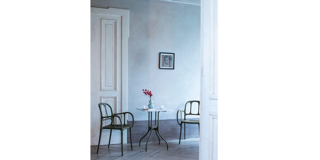 stackable dining room chairs made of aluminum with black openings in the back