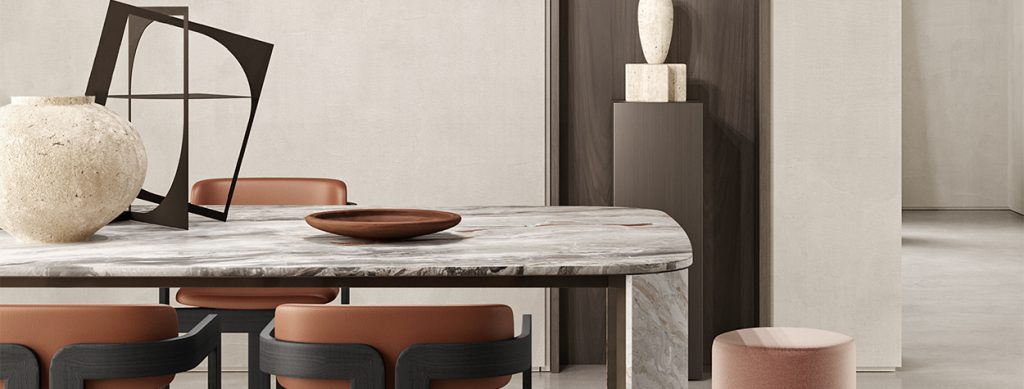 A modern dining space featuring a marble table with rounded edges, warm-toned leather chairs, and minimalist decor against a neutral backdrop