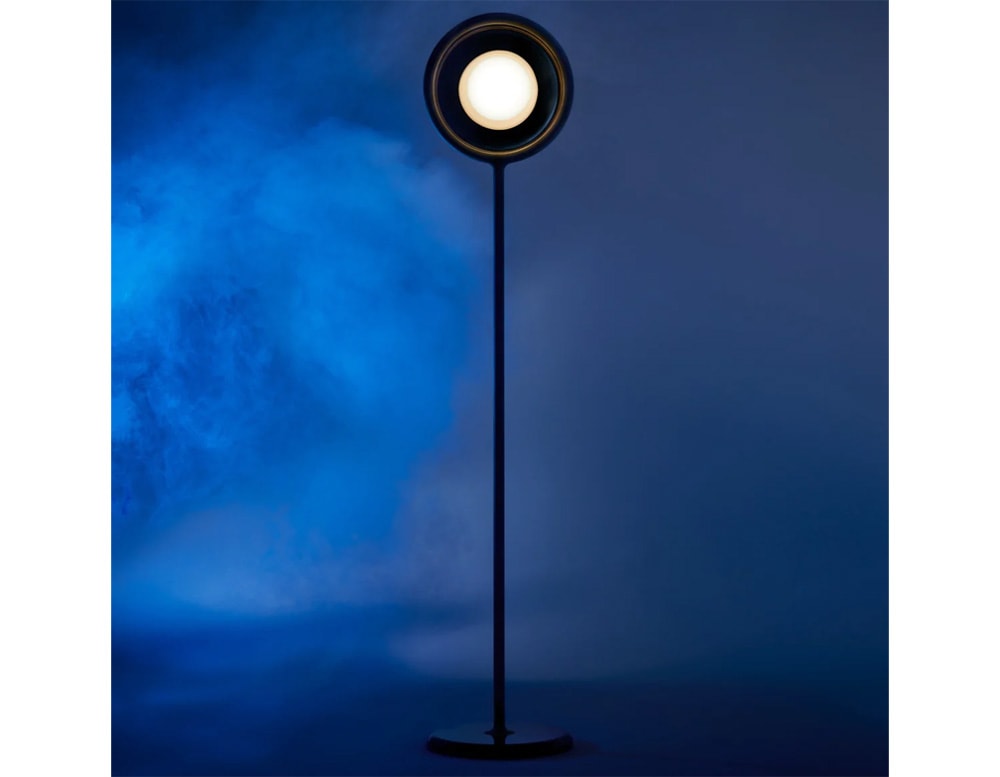 floor lamp made of metal by hand in a gold, black and white tone for its LED lighting