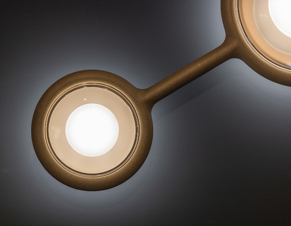 lamp made with hand-cast metal and white LED light in a golden tone