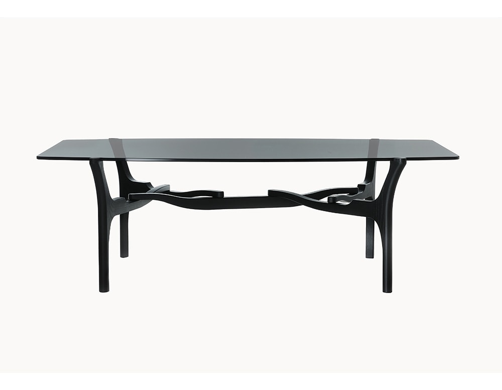 table made of black wood and black or transparent glass top